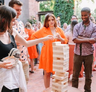 Members from the OHO team play a game of Jenga at the annual OHO Summit