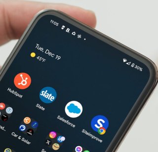 Apps displayed on a mobile device, including Hubspot, Slate, Salesforce, and Siteimprove
