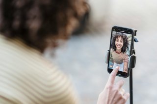 A woman sets up a POV video recording